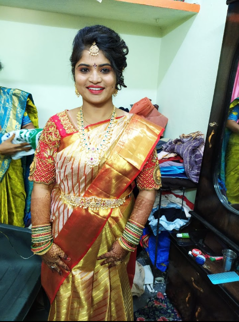Bride in red and gold silk saree