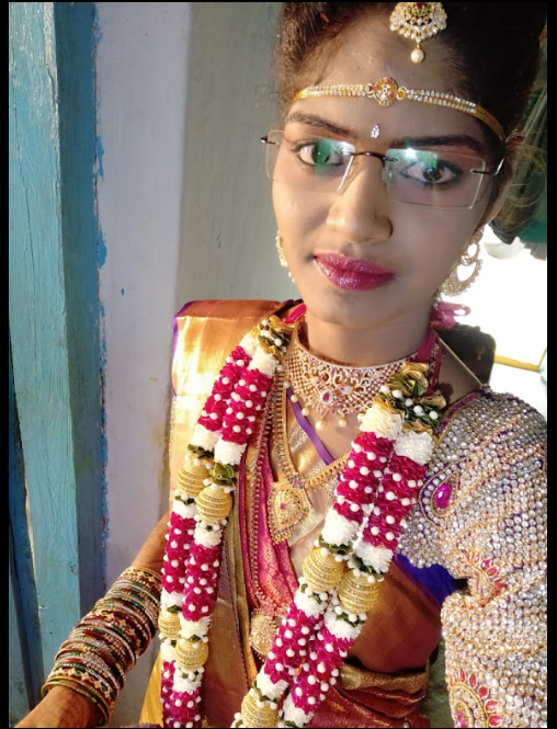 Bride in traditional jewelry and floral garland