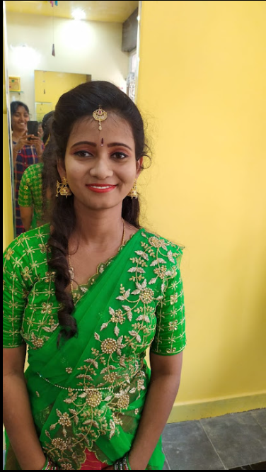 Smiling client in green saree